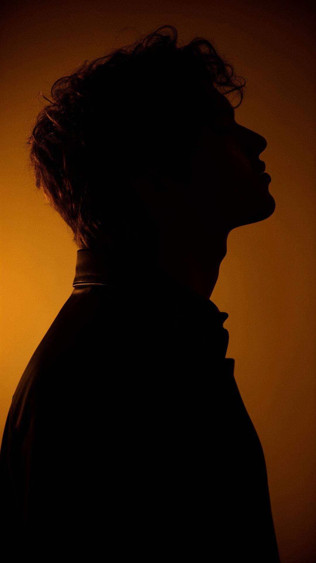Artist in dramatic editorial light